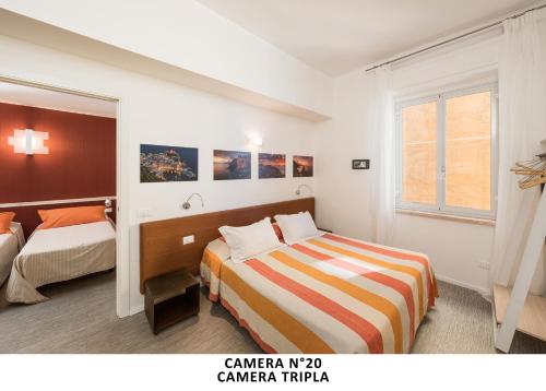 Postel nebo postele na pokoji v ubytování Al mare (Guesthouse)