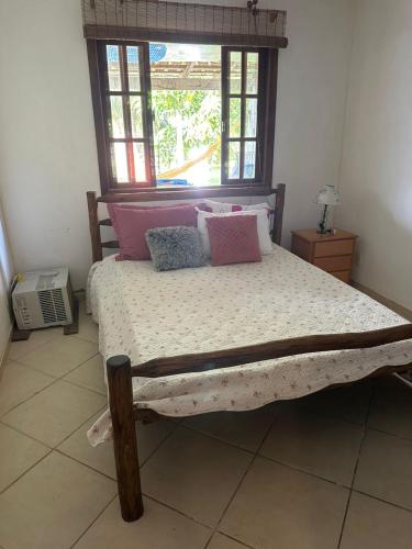 Giường trong phòng chung tại Casa em Búzios