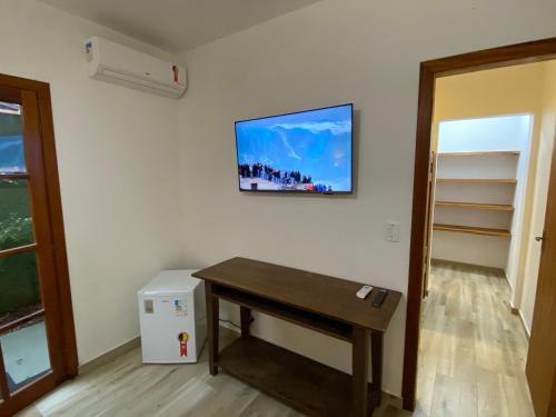 TV tai viihdekeskus majoituspaikassa Lalabella Praia Grande