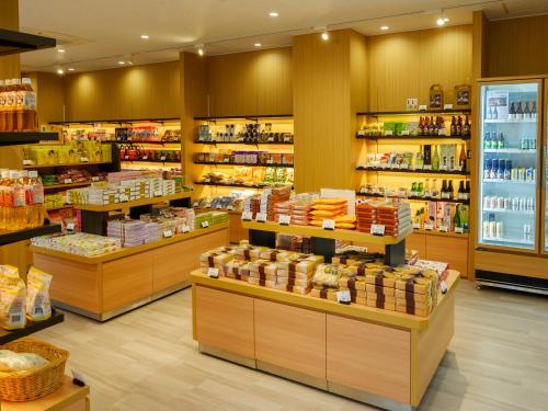 a grocery store aisle with a lot of products at KAMENOI HOTEL Atami in Atami