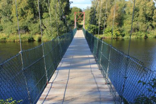 a bridge over a body of water at Gauvik - Lyngdal in Lyngdal