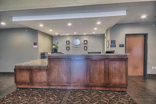 a lobby with a reception desk in a building at Comfort Suites Marietta-Parkersburg in Marietta