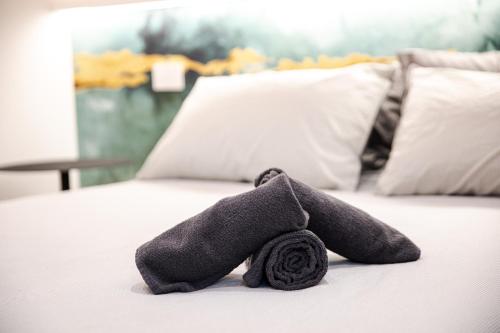 a stuffed animal is laying on a bed at Dimora Palatina in Tivoli