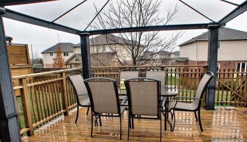 a patio with a table and chairs on a deck at HB Guest Home in Waterloo