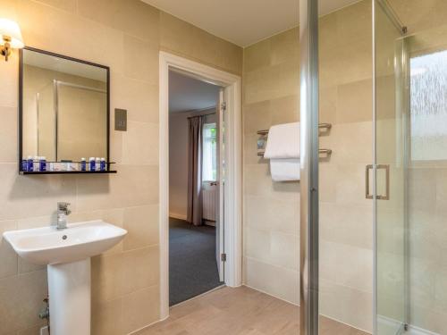 a bathroom with a sink and a shower at 2 Bed in St. Mellion 87710 in St Mellion