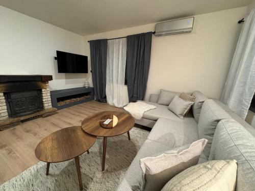 a living room with a couch and a table at Grandpa's Chalet Jahorina in Jahorina
