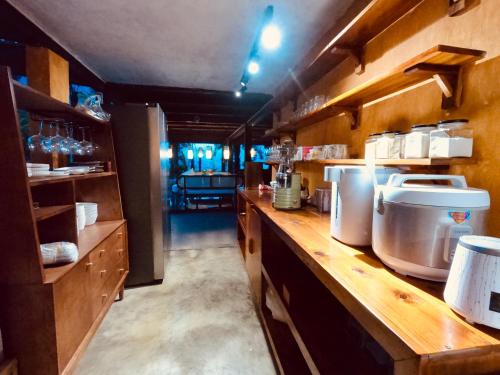 a kitchen with a counter and a counter top at Luxury Traditional Chalet in Ha Giang