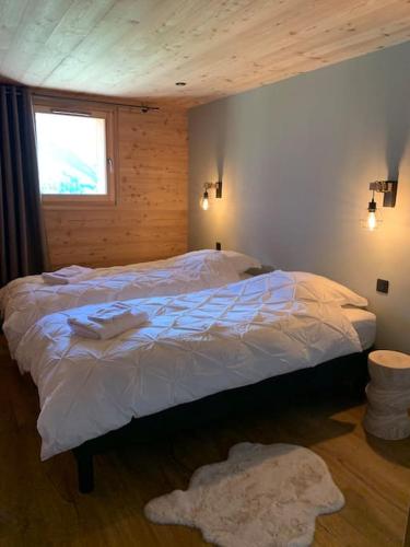 Postel nebo postele na pokoji v ubytování Superbe chalet avec vue montagne