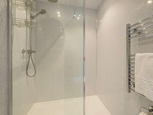 a shower with a glass door in a bathroom at 2 Bed in Wasdale SZ515 in Nether Wasdale