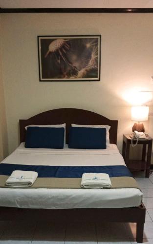 Katil atau katil-katil dalam bilik di Fuente Hotel de Cebu