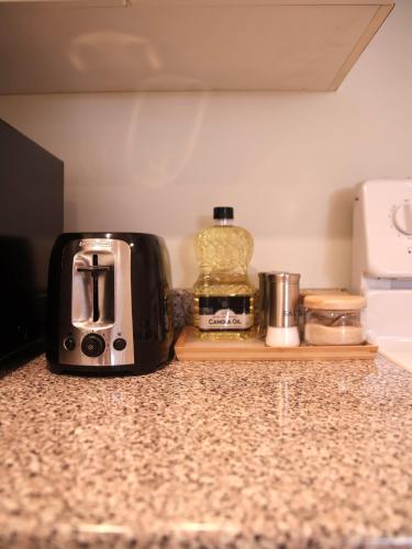 a toaster sitting on top of a kitchen counter at A private suite in Port Moody in Port Moody