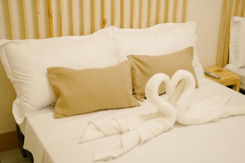 Ένα ή περισσότερα κρεβάτια σε δωμάτιο στο Pallet Homes - Megaworld