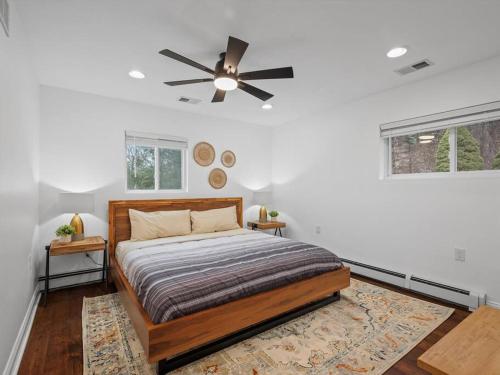 a bedroom with a bed and a ceiling fan at Modern and Accessible 5 Bedroom Home in Wexford/Pittsburgh with Private Pool in Wexford
