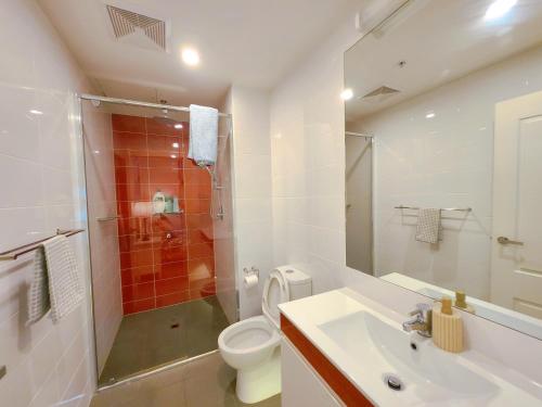a bathroom with a shower and a toilet and a sink at TAO-Dream of Rowlands in Adelaide