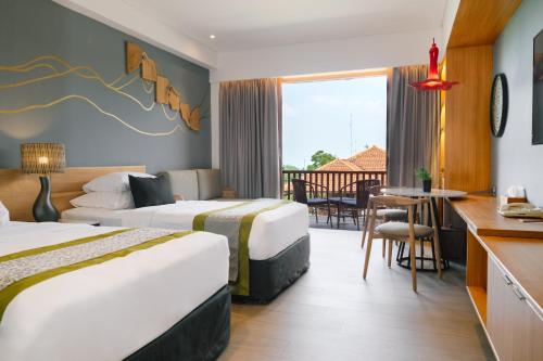 a hotel room with two beds and a balcony at Novus Giri Resort & Spa in Puncak