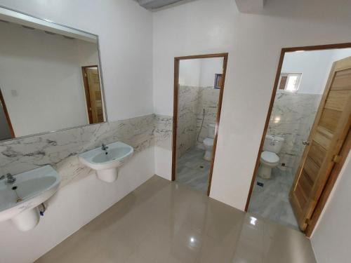 a bathroom with two sinks and two toilets at CMJ Private Resort 