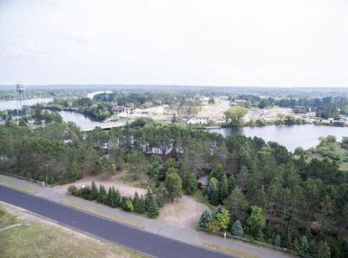 an aerial view of a river and a road at Fancy Fireflies Cabin in Hayward