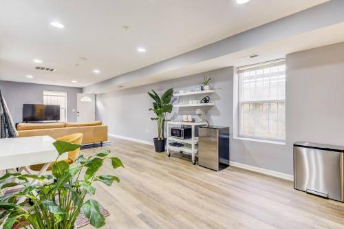 a living room with a couch and a table at Spacious Suite in Deanwood + Free Parking in Washington, D.C.