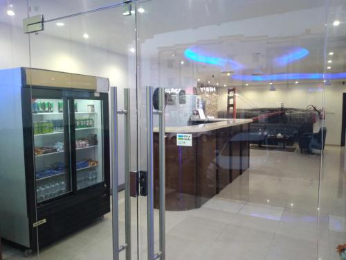 a kitchen with a counter and a refrigerator at سحاب فيو in Abha