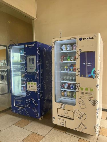 two vending machines are sitting next to each other at Sky House BSD Studio by Shinzhouz in Cilandak