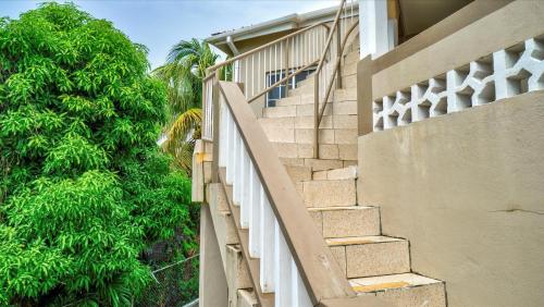 a set of stairs leading up to a building at Kaibus Place- Quaint Quiet and Cosy in Morne Rouge