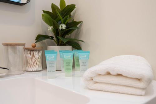 a group of four products sitting on a bathroom counter at Dream Home Rentals in Burbank