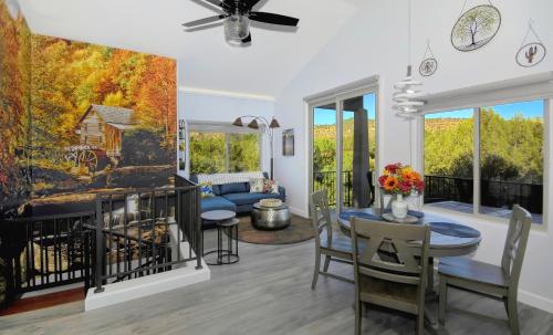a dining room and living room with a table and chairs at Cathedral Casita at Sedona Cathedral Hideaway LLC in Sedona