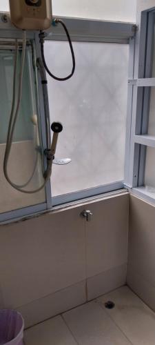 a window in a bathroom with a hose at AVA Boutique Guesthouse in Koh Tao