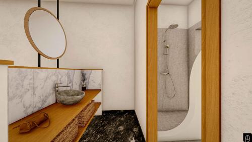 uma casa de banho com um lavatório e um chuveiro em SPONGIA HOTEL AND SUITES em Myrties