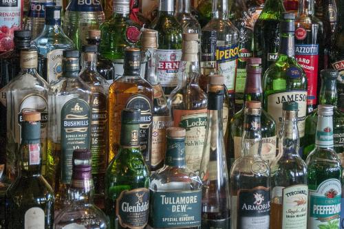 a large group of bottles of alcohol on a wall at Hajo´s Germania Lodge & Irish Pub in Rüdesheim am Rhein