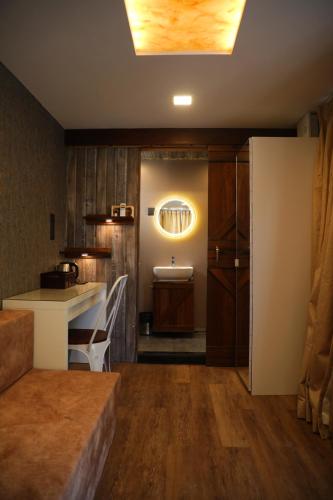 a room with a kitchen with a counter and a sink at Out of Box Living Kashid,Murud in Kashid