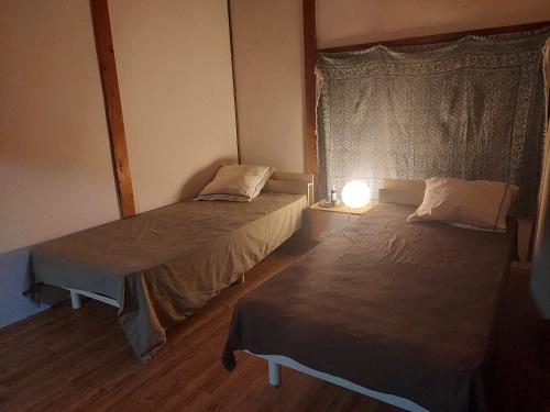 A bed or beds in a room at 住み開き宿 鶴島邸 Tsurushima stay