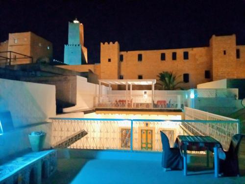 a view of a building at night at Dar Baaziz 3 in Sousse