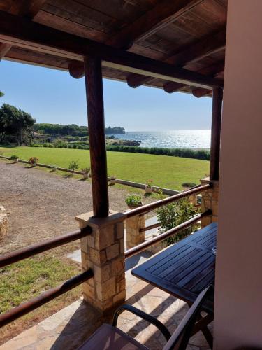 a view of the ocean from the porch of a house at Armiriki Apartments in Korakokhórion