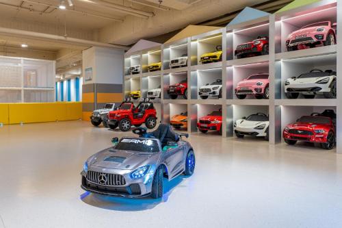 a garage with a lot of cars and a toy car at Tempus Hotel in Taichung