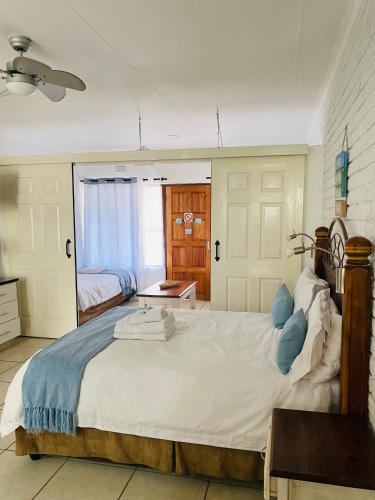Ένα ή περισσότερα κρεβάτια σε δωμάτιο στο St. Lucia Safari Lodge