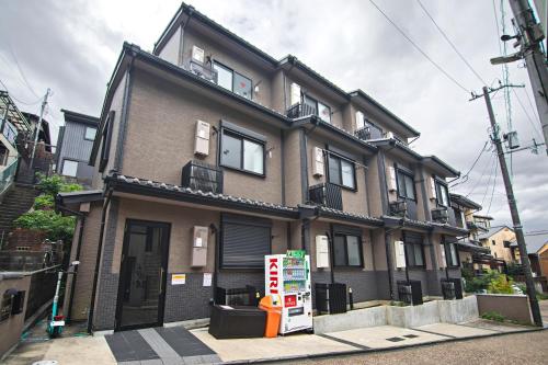 a building with a soda machine in front of it at 清水三年坂 Home in Kyoto in Kyoto