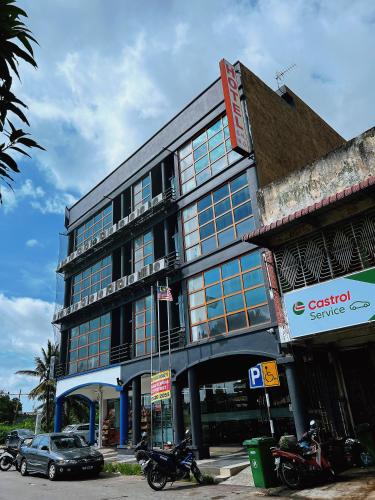 a building with motorcycles parked in front of it at Hotel Economy Kapar in Kapar