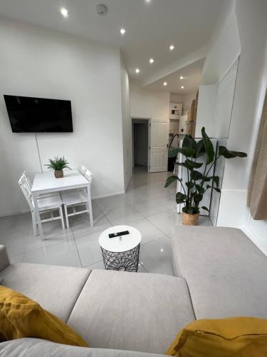 a living room with a couch and a table at Stylish Flat in Camden/KingsCross in London