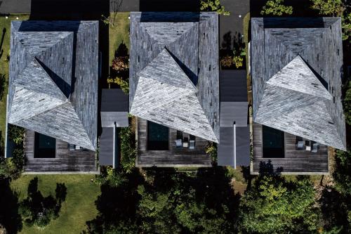 an overhead view of a building with a roof at Miru Amami in Tatsugo