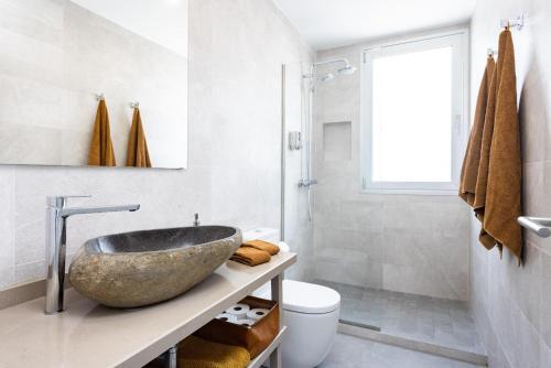a bathroom with a bowl sink on a counter at Home Of Tulio in Adeje