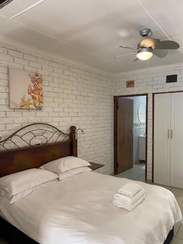Ένα ή περισσότερα κρεβάτια σε δωμάτιο στο St. Lucia Safari Lodge