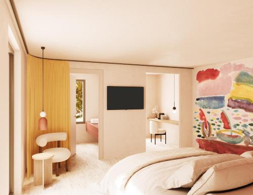 een slaapkamer met een bed met een schilderij aan de muur bij Maison Nova - Boutique Hôtel & Spa in Collioure