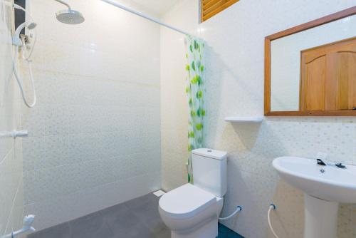 a bathroom with a toilet and a sink at Sabba Summer Suite , Fodhdhoo in Fodhdhoo