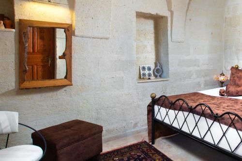 Postel nebo postele na pokoji v ubytování Romantic Cave Hotel