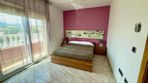 Ένα ή περισσότερα κρεβάτια σε δωμάτιο στο MEDDAYS VILLA JADE