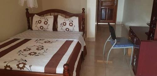 מיטה או מיטות בחדר ב-Atkon Hotel-Kiboga