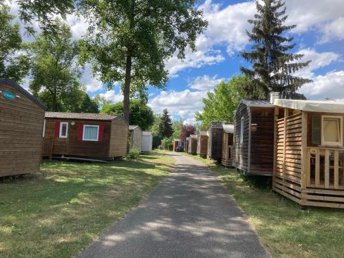 a row of wooden huts in a park at Mobile home in Vogelgrun
