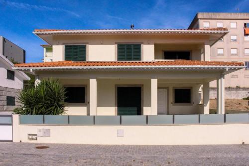 a large white house with a balcony on a street at Casa da Tapada in Memorial