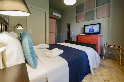 Letto o letti in una camera di GUEST HOUSE SONNINO 37 Cagliari